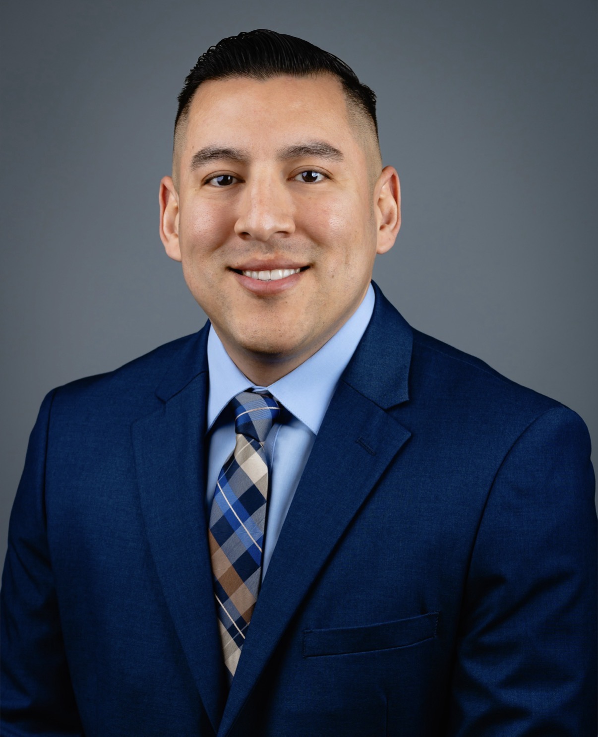 Professional headshot of Alberto Aguirre